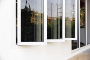 three,panel,aluminium,casement,window,stay,on,white,wall.